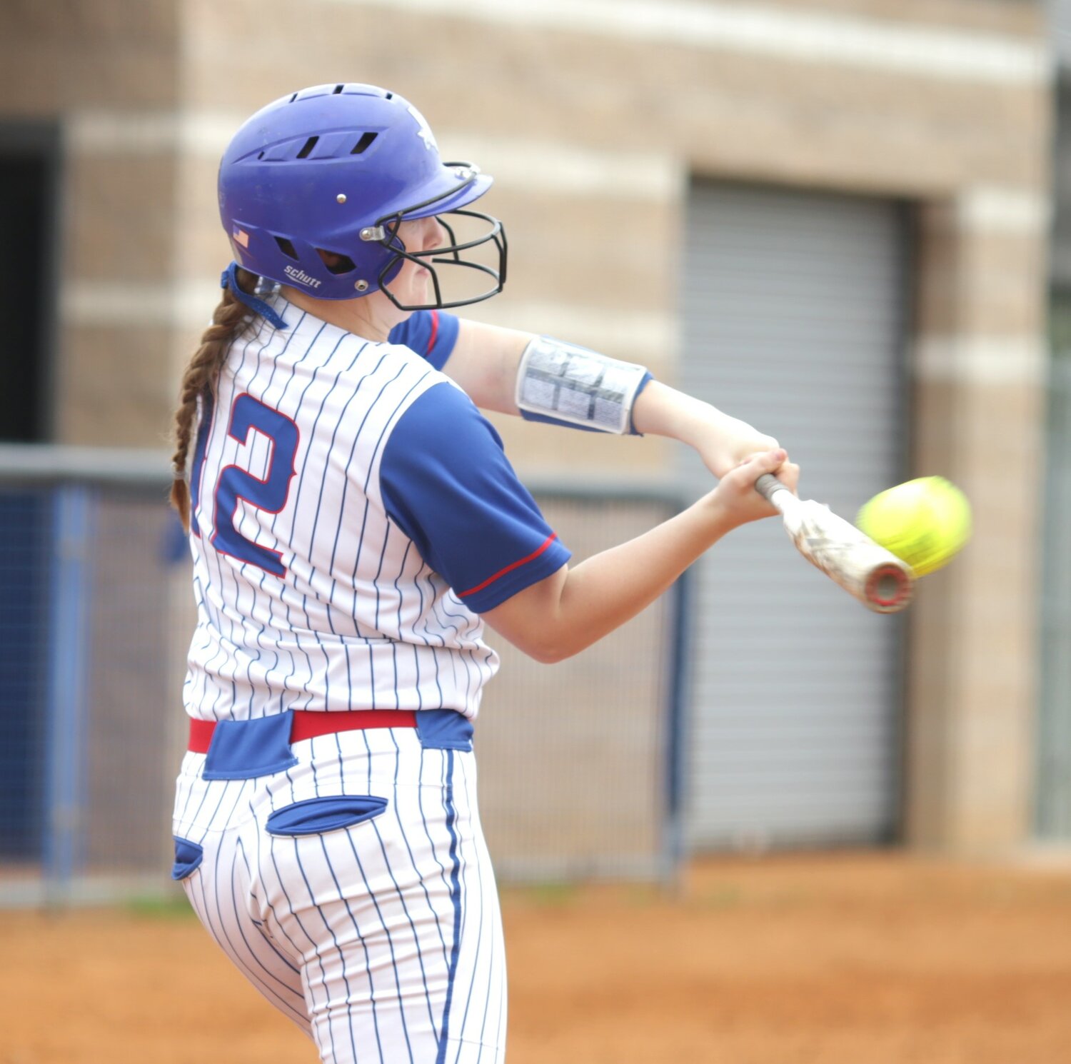 “Lady Bulldog Kori Hammond cracks a bases-loaded double in the win against Chapel Hill. (Monitor photo by John Arbter)